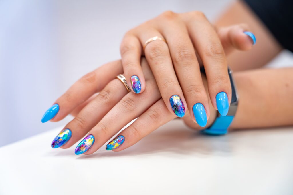 women showing her blue rounded nail art