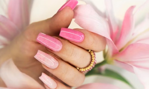 hand with pink Bridal Nail Art design